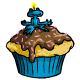 This delicious cupcake has a little blue candle shaped like a Nimmo on the top.