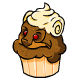 This cupcake is topped off with a generous helping of vanilla icing.