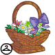 Assorted flowers are arranged artfully in a pretty basket shaped like faerie wings.