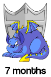 7 Months: A smiling blue skeith, laying down infront of a silver user shield