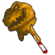 A chocolate Grarrl head, dipped in caramel and then slotted on a stick.