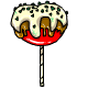 A caramel apple, topped with cheese, sour cream and chives.