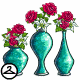 A tasteful display of red roses and white poinsettias in shimmering turquoise vases.